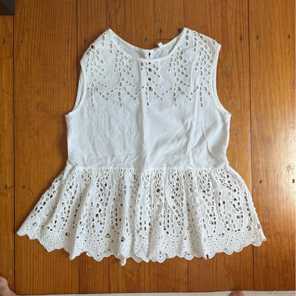 White peplum sleeveless top